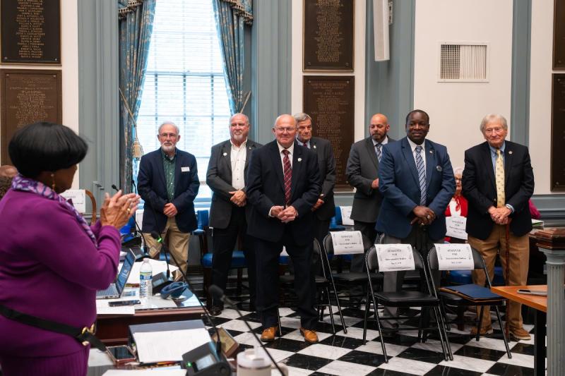 About 60 local elected officials and town managers were honored May 13 in Dover by Delaware’s General Assembly, lieutenant governor and governor via the long-standing tradition of Delaware Local Government Day. Rep. Stephanie Bolden, far left, recognizes Delaware League of Local Governments Executive Committee members. Shown are (l-r) Bethany Beach Mayor Ron Calef; Dewey Beach Commissioner Paul Bauer; Georgetown mayor and DLLG Vice President Bill West; Middletown Mayor Kenny Branner; Clayton mayor and DLLG President Nick Smith; Milford Vice Mayor Jason James; and Millville Mayor Ron Belinko.